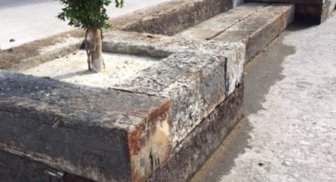Old oak creosated railway sleepers used as steps and flower beds